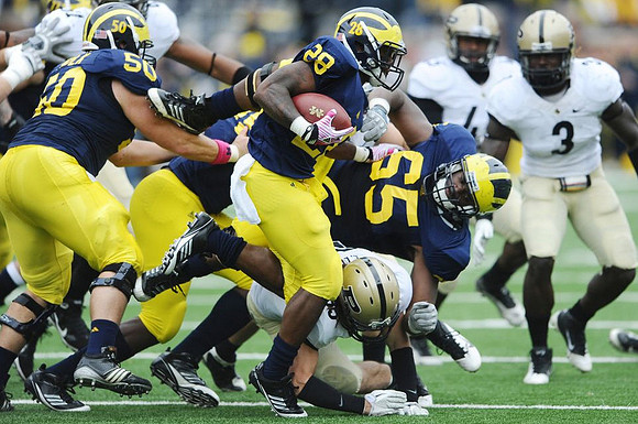David Molk (50), Michael Schofield (75), Fitzgerald Toussaint (28), and Patrick Omameh (65)