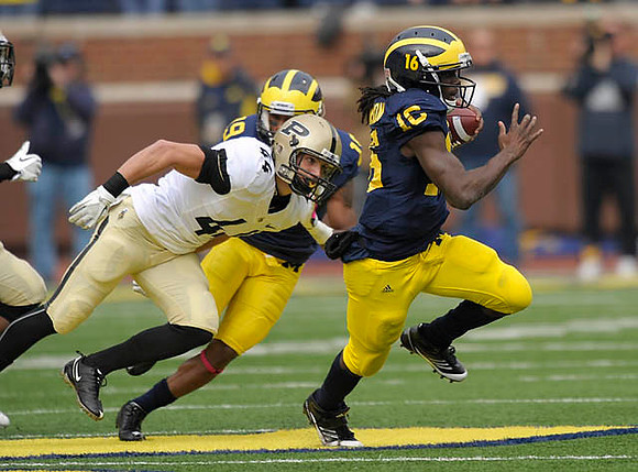 Kelvin Grady (19) and Denard Robinson (16)