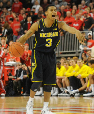 Nik Stauskas (11) and Mitch McGary (4)