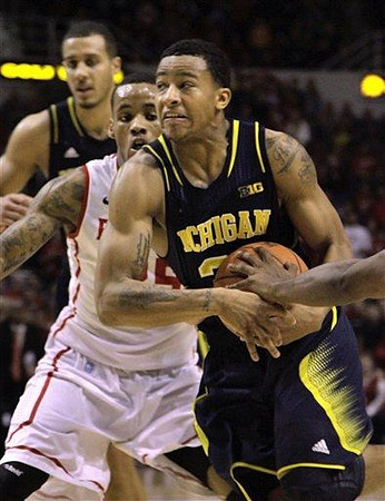 Trey Burke (3) and Jordan Morgan (52)
