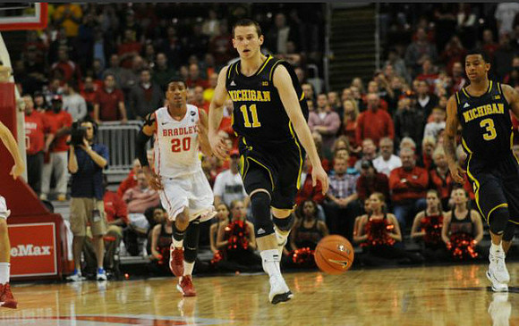 Spike Albrecht (2), Tim Hardaway Jr. (10), and Bradley Head coach Geno Ford