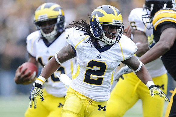 Vincent Smith (2), Denard Robinson (16), and Kevin Koger (86)