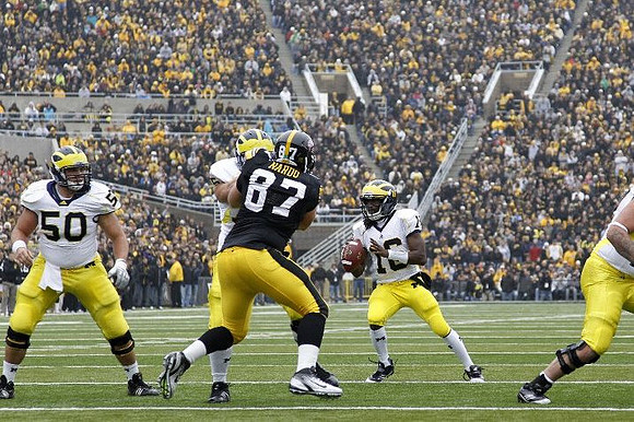 David Molk (50), Michael Schofield (75), and Denard Robinson (16)