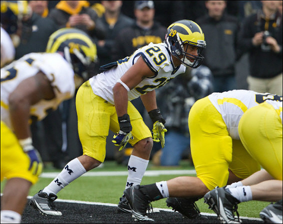 Kenny Demens (25), Troy Woolfolk (29), and Mike Martin (68)