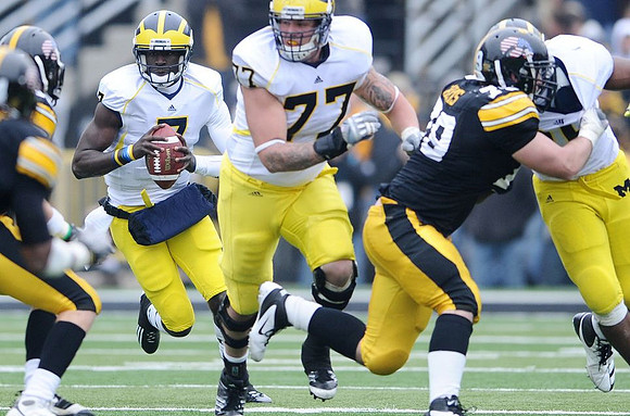 Devin Gardner (7) and Taylor Lewan (77)