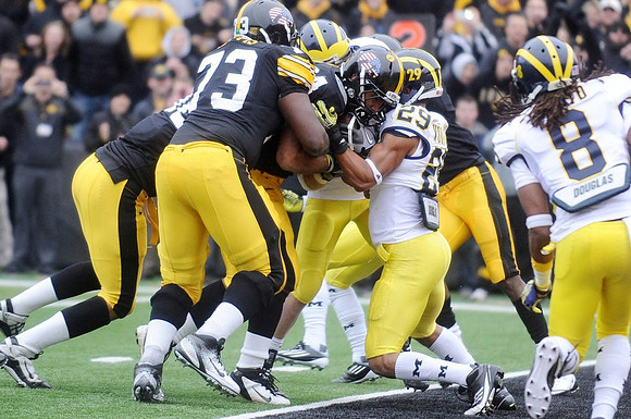 Troy Woolfolk (29) and J.T. Floyd (8)