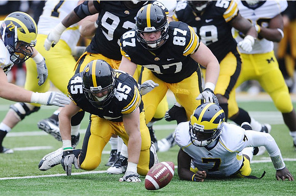 Mark Huyge (72), Taylor Lewan (77), and Devin Gardner (7)