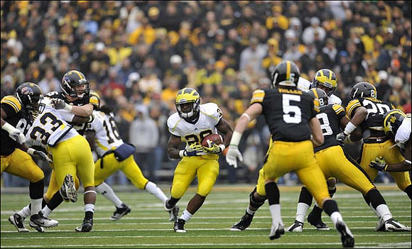 Stephen Hopkins (33), Denard Robinson (16), Fitzgerald Toussaint (28), and Kevin Koger (86)