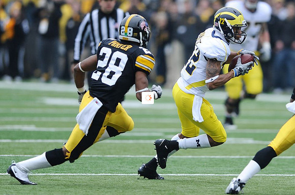 Roy Roundtree (12) and Taylor Lewan (77)