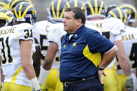 Jared Van Slyke (31) and Brady Hoke