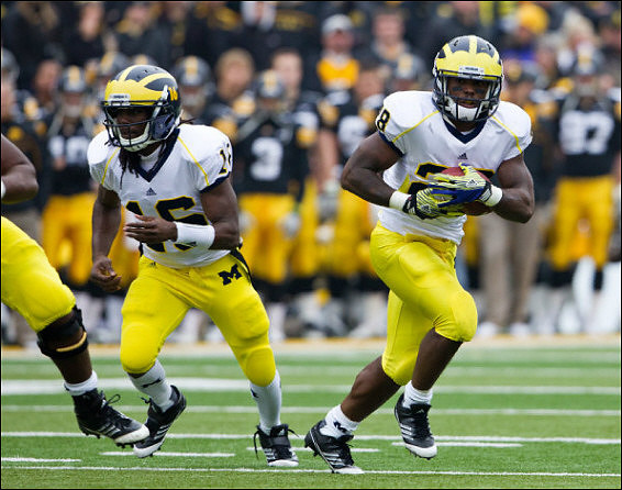 Denard Robinson (16) and Fitzgerald Toussaint (28)