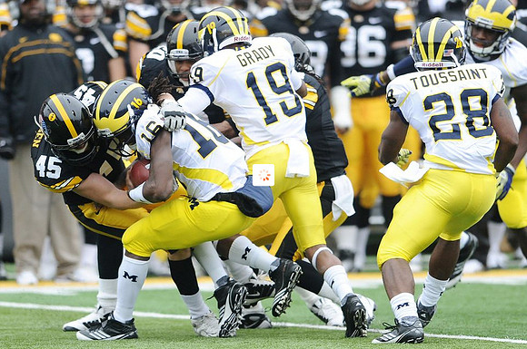 Denard Robinson (16), Kelvin Grady (19), and Fitzgerald Toussaint (28)