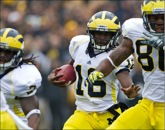 Vincent Smith (2), Denard Robinson (16), and Kevin Koger (86)