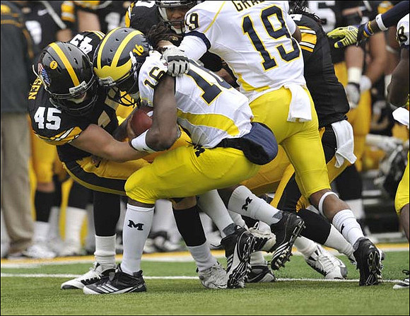 Denard Robinson (16) and Kelvin Grady (19)