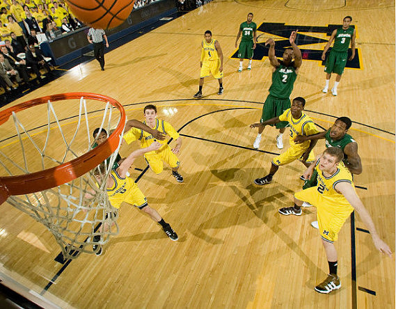 Zack Novak (0), Stu Douglass (1), Darius Morris (4), Manny Harris (3), and Zack Gibson (32)