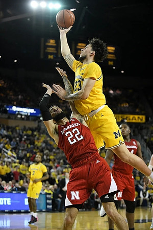 Zavier Simpson (3) and Brandon Johns Jr. (23)