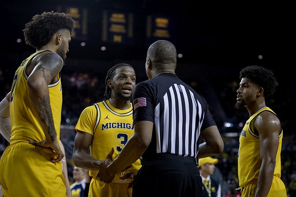 Isaiah Livers (2), Zavier Simpson (3), and David DeJulius (0)