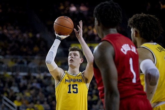 Jon Teske (15) and Isaiah Livers (2)