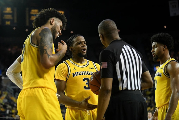 Isaiah Livers (2), Zavier Simpson (3), and David DeJulius (0)