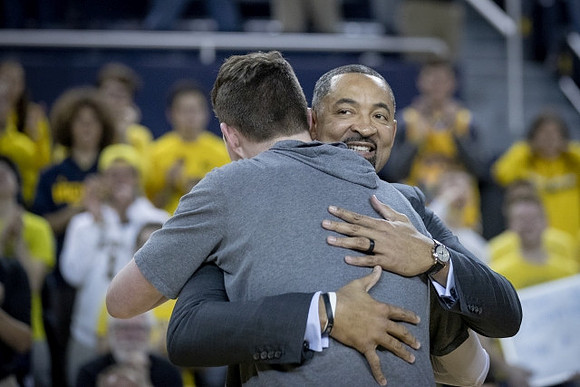 Jon Teske (15) and Jim Harbaugh