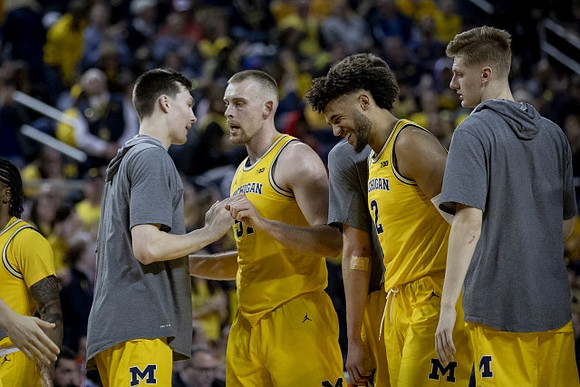Zavier Simpson (3), Colin Castleton (11), Austin Davis (51), Isaiah Livers (2), and Cole Bajema (22)