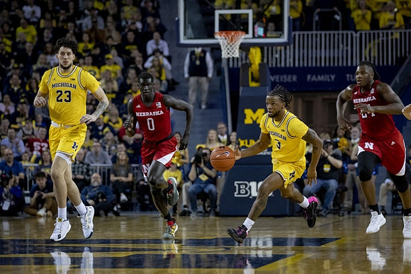 Brandon Johns Jr. (23) and Zavier Simpson (3)