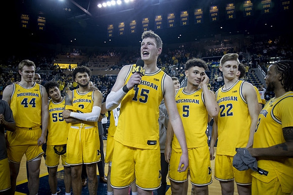 Jon Teske (15) and Michigan Team