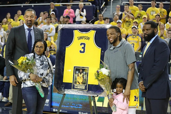 Juwan Howard and Zavier Simpson (3)