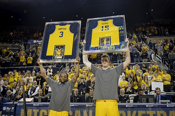 Zavier Simpson (3) and Jon Teske (15)