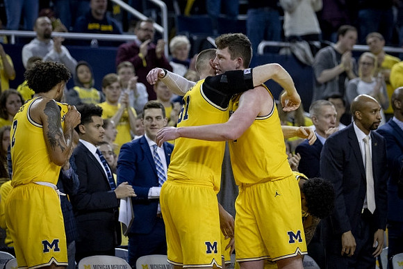 Isaiah Livers (2), Austin Davis (51), Jon Teske (15), and Saddi Washington