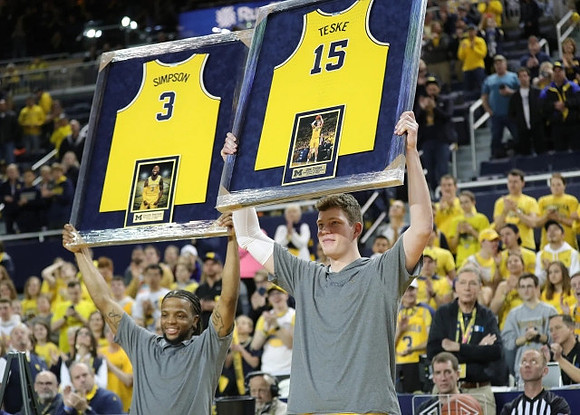 Zavier Simpson (3) and Jon Teske (15)