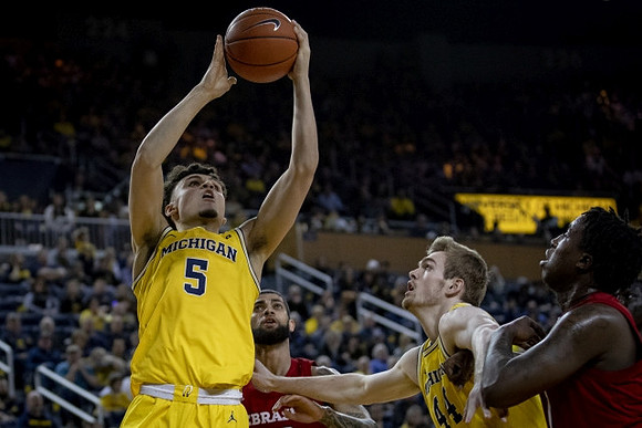 Adrien Nunez (5) and Jaron Faulds (44)