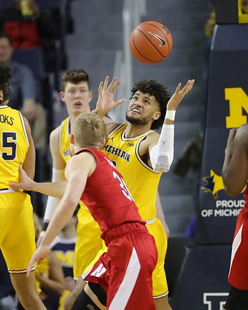 Eli Brooks (55), Jon Teske (15), and Isaiah Livers (2)