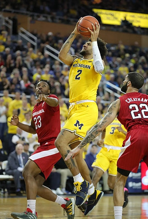 Isaiah Livers (2) and Zavier Simpson (3)