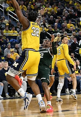 Tarris Reed Jr. (32) and Jaelin Llewellyn (3)