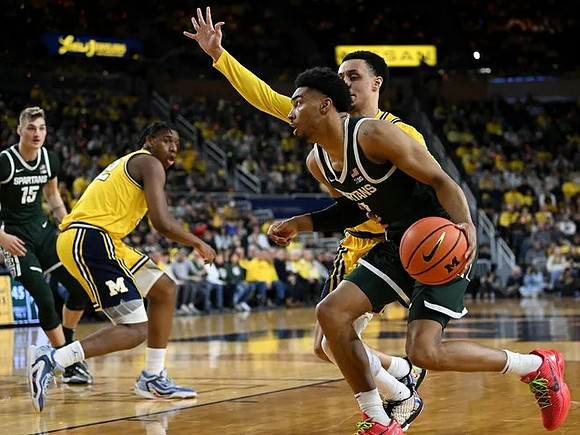 Tarris Reed Jr. (32) and Jaelin Llewellyn (3)