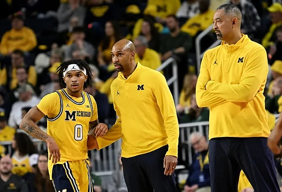 Dug McDaniel (0), Saddi Washington, and Juwan Howard