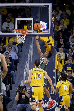 Olivier Nkamhoua (13) and Dug McDaniel (0)