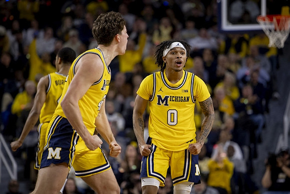 Nimari Burnett (4), Will Tschetter (42), and Dug McDaniel (0)