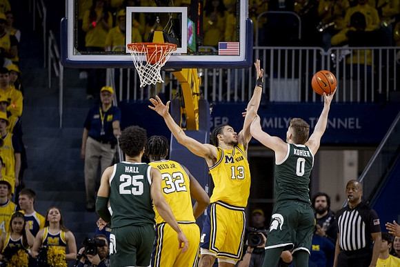 Tarris Reed Jr. (32) and Olivier Nkamhoua (13)