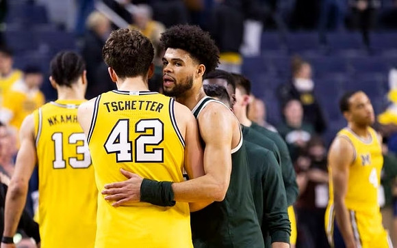 Olivier Nkamhoua (13), Will Tschetter (42), and Nimari Burnett (4)
