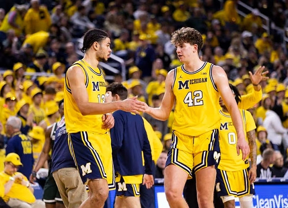Olivier Nkamhoua (13), Will Tschetter (42), and Dug McDaniel (0)