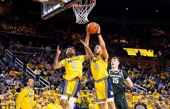 Jaelin Llewellyn (3), Dug McDaniel (0), and Olivier Nkamhoua (13)