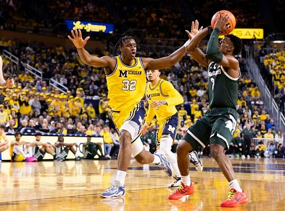 Tarris Reed Jr. (32) and Jaelin Llewellyn (3)