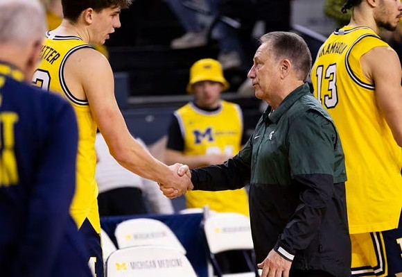 Will Tschetter (42), Michigan State Head Coach Tom Izzo, and Olivier Nkamhoua (13)