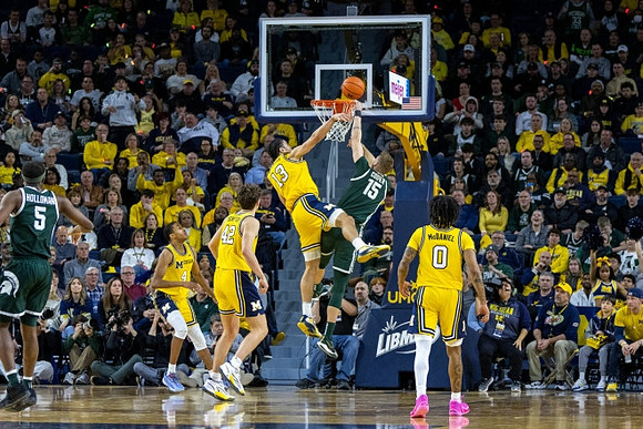 Nimari Burnett (4), Will Tschetter (42), Olivier Nkamhoua (13), and Dug McDaniel (0)