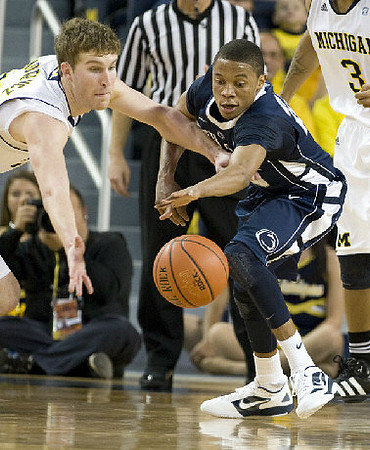 Evan Smotrycz (23) and Trey Burke (3)