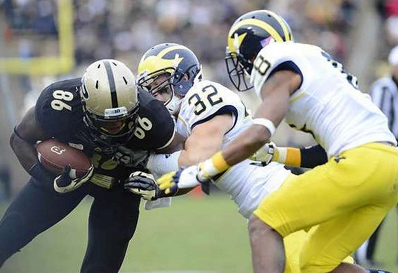 Jordan Kovacs (32) and J.T. Floyd (8)