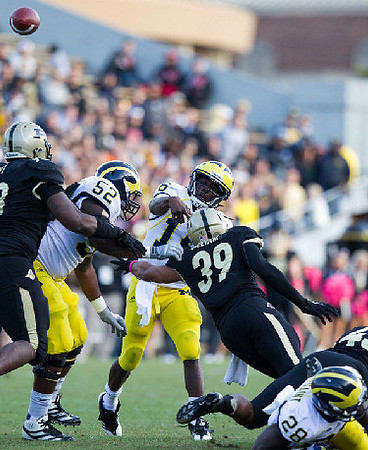 Ricky Barnum (52), Denard Robinson (16), and Fitzgerald Toussaint (28)