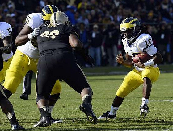 Ricky Barnum (52), Patrick Omameh (65), and Denard Robinson (16)